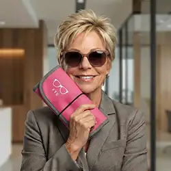 ftg founder suzanne sendel showing the FTG glasses organizer "pretty-in-pink"by frames2go